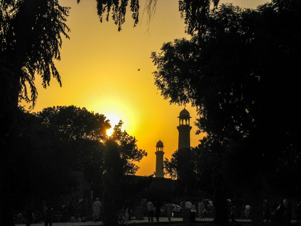 Setting sun behind the Minarets of a neighborhood Mosque