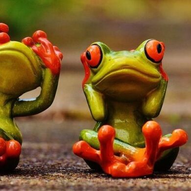 Three frogs in poses showing hear no evil, see no evil, speak no evil
